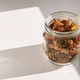 raw amber lies in a glass jar in the rays of the sun raw amber lies in a glass jar in the rays of the sun - PhotoDune Item for Sale