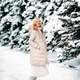 Fashion young smiling blonde woman in winter. Standing among snowy trees in winter forest. Fashion young smiling blonde woman in winter. Standing among snowy trees in winter forest. - PhotoDune Item for Sale