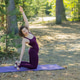 Young woman doing yoga outdoors in the park Young woman doing yoga outdoors in the park - PhotoDune Item for Sale