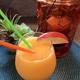 Closeup of refreshing glass of orange juice with straws and apple slice set on round table mat Closeup of refreshing glass of orange juice with straws and apple slice set on round table mat - PhotoDune Item for Sale