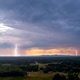 Dramatic lightning storm over lush valley during sunset in countryside Dramatic lightning storm over lush valley during sunset in countryside - PhotoDune Item for Sale