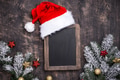Christmas dark background with Santa hat Christmas dark background with Santa hat - PhotoDune Item for Sale