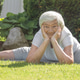 an old, senior,elderly gray-haired woman does exercises, yoga in the backyard, in the garden an old, senior,elderly gray-haired woman does exercises, yoga in the backyard, in the garden - PhotoDune Item for Sale