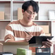 Male entrepreneur is holding clipboard to checking products before packing into cardboard boxes Male entrepreneur is holding clipboard to checking products before packing into cardboard boxes - PhotoDune Item for Sale