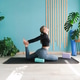 woman practicing yoga on mat stretching in a pigeon pose with yoga blocks woman practicing yoga on mat stretching in a pigeon pose with yoga blocks - PhotoDune Item for Sale