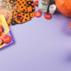Halloween purple frame background flatlay with pumpkins and party decor Halloween purple frame background flatlay with pumpkins and party decor - PhotoDune Item for Sale