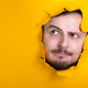 Man through a hole yellow paper thinking Man through a hole yellow paper thinking - PhotoDune Item for Sale