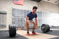 Athlete starting a deadlift in a crossfit gym Athlete starting a deadlift in a crossfit gym - PhotoDune Item for Sale