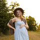 Pregnant woman in summer dress enjoying nature outdoors Pregnant woman in summer dress enjoying nature outdoors - PhotoDune Item for Sale