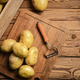 Fresh potatoes. On wooden table. Fresh potatoes. On wooden table. - PhotoDune Item for Sale