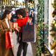 Diverse friends enjoying christmas shopping with gifts Diverse friends enjoying christmas shopping with gifts - PhotoDune Item for Sale