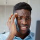 Serious businessman talking on the phone and working in computer Serious businessman talking on the phone and working in computer - PhotoDune Item for Sale