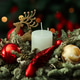 a composition with a candle, red and gold ornaments a composition with a candle, red and gold ornaments - PhotoDune Item for Sale