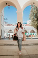 Lifestyle portrait of beautiful young woman in casual but stylish clothes standing in city. Lifestyle portrait of beautiful young woman in casual but stylish clothes standing in city. - PhotoDune Item for Sale