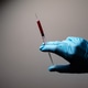Doctor's hand with blood probe. Coronavirus test Doctor's hand with blood probe. Coronavirus test - PhotoDune Item for Sale