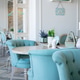 A blue armchair at an empty table in a Provence cafe. A blue armchair at an empty table in a Provence cafe. - PhotoDune Item for Sale
