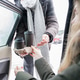a man gives a girl a cup of coffee in a car salon a man gives a girl a cup of coffee in a car salon - PhotoDune Item for Sale