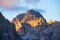 High rocks during sunset. Dolomite Alps, Italy. Mountains and cloudy skies. View of mountains and cl High rocks during sunset. Dolomite Alps, Italy. Mountains and cloudy skies. View of mountains and cl - PhotoDune Item for Sale