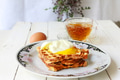 Toast bread with poached egg and cup of tea on white wooden table Toast bread with poached egg and cup of tea on white wooden table - PhotoDune Item for Sale