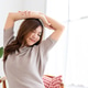 Young woman stretching her arms feeling relaxed and happy Young woman stretching her arms feeling relaxed and happy - PhotoDune Item for Sale