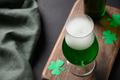 Patrick's day green beer in glass on black. Patrick's day green beer in glass on black. - PhotoDune Item for Sale