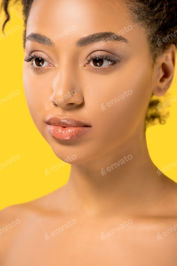 african girl nudist beautiful nude african american girl with clean face, isolated on yellow Stock Photo by LightFieldStudios