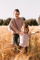 Two little girls children walking in ripe rye wheat field. Countryside life concept. Vertical image Two little girls children walking in ripe rye wheat field. Countryside life concept. Vertical image - PhotoDune Item for Sale