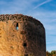 Ancient stone tower at Monasterio de Piedra against a bright blue sky Ancient stone tower at Monasterio de Piedra against a bright blue sky - PhotoDune Item for Sale