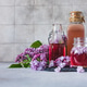 Preparation of syrup from the lilac flowers. Glass jar of homemade lilac syrup and lilac flowers Preparation of syrup from the lilac flowers. Glass jar of homemade lilac syrup and lilac flowers - PhotoDune Item for Sale