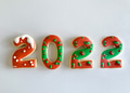 Baked 2022 Christmas cookies decorated with red and green Christmas colors on white background Baked 2022 Christmas cookies decorated with red and green Christmas colors on white background - PhotoDune Item for Sale