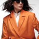 Spectacular beautiful woman in a trendy orange suit with classic make-up. Beauty face. Spectacular beautiful woman in a trendy orange suit with classic make-up. Beauty face. - PhotoDune Item for Sale