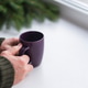 hands of an old man holding a cup of coffee on the background of a natural Christmas tree hands of an old man holding a cup of coffee on the background of a natural Christmas tree - PhotoDune Item for Sale