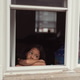 diverse child at home looking out window, lonely bored and sad diverse child at home looking out window, lonely bored and sad - PhotoDune Item for Sale
