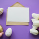 Easter greetings: colored eggs, white tulips. Letter with copy space. Hand holds golden Easter egg Easter greetings: colored eggs, white tulips. Letter with copy space. Hand holds golden Easter egg - PhotoDune Item for Sale