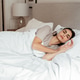 Woman in bed with headphones listening to meditation or relaxing sleep music Woman in bed with headphones listening to meditation or relaxing sleep music - PhotoDune Item for Sale