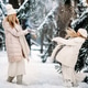 Handsome mother and daughter are having fun outdoor in winter time. Playing with snow in forest Handsome mother and daughter are having fun outdoor in winter time. Playing with snow in forest - PhotoDune Item for Sale
