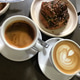 Plate of croissant flavour of the month and cups of coffee at a small cafe for breakfast catch up. Plate of croissant flavour of the month and cups of coffee at a small cafe for breakfast catch up. - PhotoDune Item for Sale