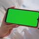 Unknown girl browsing greenscreen mobile phone app lying on cozy bedding closeup Unknown girl browsing greenscreen mobile phone app lying on cozy bedding closeup - PhotoDune Item for Sale