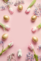 Easter frame of pink tulips, golden eggs and bunny on pastel pink. Top view with copy space. Easter frame of pink tulips, golden eggs and bunny on pastel pink. Top view with copy space. - PhotoDune Item for Sale