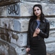 Portrait of a young woman wearing all black Portrait of a young woman wearing all black - PhotoDune Item for Sale