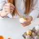 Young woman coloring eggs for Easter at home, closeup hands Young woman coloring eggs for Easter at home, closeup hands - PhotoDune Item for Sale