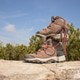 Pair of hiking boots stacked on a stone surface Pair of hiking boots stacked on a stone surface - PhotoDune Item for Sale