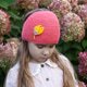 Adorable Girl Wearing a Crochet Headband with Hydrangeas in the Background - Outdoor Portrait. Adorable Girl Wearing a Crochet Headband with Hydrangeas in the Background - Outdoor Portrait. - PhotoDune Item for Sale