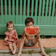 Brother and sister eating watermelon in summer day Brother and sister eating watermelon in summer day - PhotoDune Item for Sale