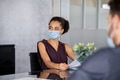 African business woman in office with face mask African business woman in office with face mask - PhotoDune Item for Sale