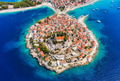 Primosten town, Croatia. View of the city from the air. Seascape with beach and old town. Primosten town, Croatia. View of the city from the air. Seascape with beach and old town. - PhotoDune Item for Sale