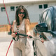 Woman Washing Car Under High Pressure Woman Washing Car Under High Pressure - PhotoDune Item for Sale
