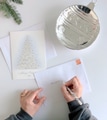 Woman addressing envelopes sending Christmas cards which is a very special Christmas tradition. Woman addressing envelopes sending Christmas cards which is a very special Christmas tradition. - PhotoDune Item for Sale