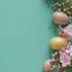 Pastel Easter Eggs and Flowers on Teal Background. Festive Spring Flatlay Pastel Easter Eggs and Flowers on Teal Background. Festive Spring Flatlay - PhotoDune Item for Sale