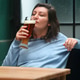 Woman Enjoying Beer in Rustic Bar Woman Enjoying Beer in Rustic Bar - PhotoDune Item for Sale